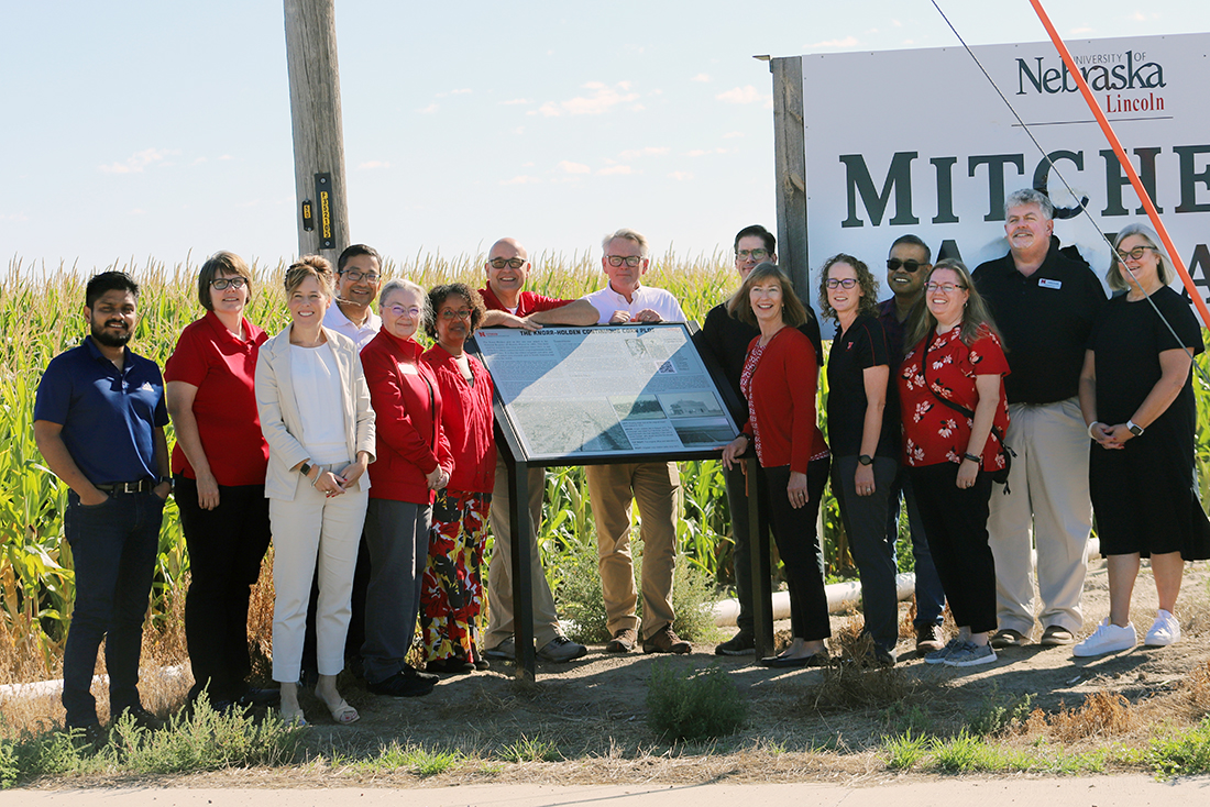 group of people at knorr-holden sign at Mitchell Ag Lab