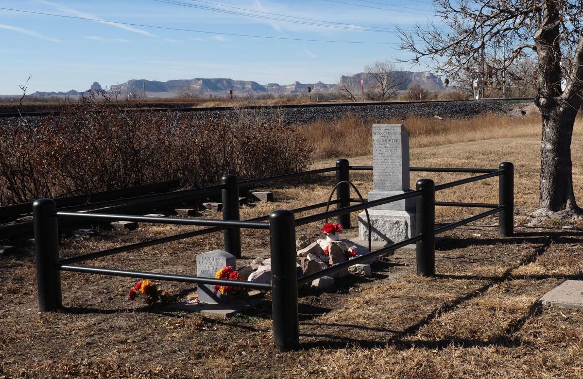 a gravestone surrounded by fence