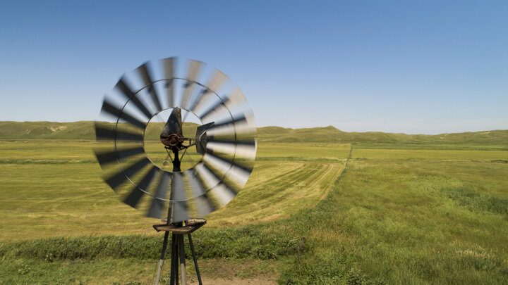 closeup of windmill on grassy plains