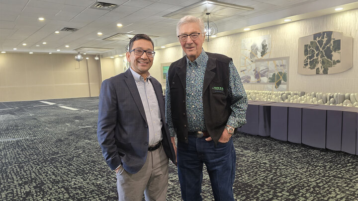 two men pose for awards photo