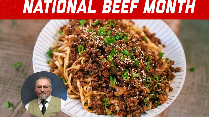 Bowl of beef noodles garnished with sesame seeds and green onions, with "National Beef Month" text.