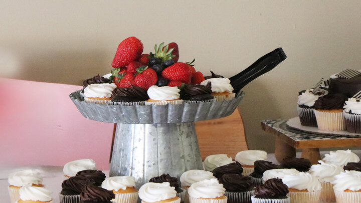 table with cupcakes and strawberries