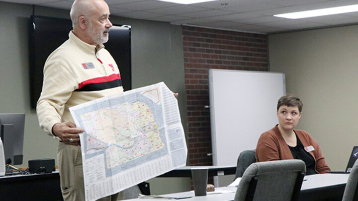 man holding map of Nebraska 