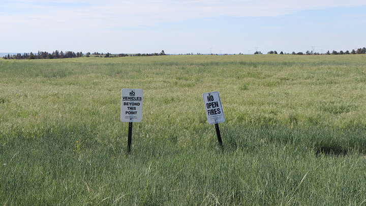 rangeland with signs "no open fires"