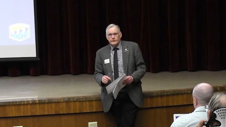 man speaking to audience